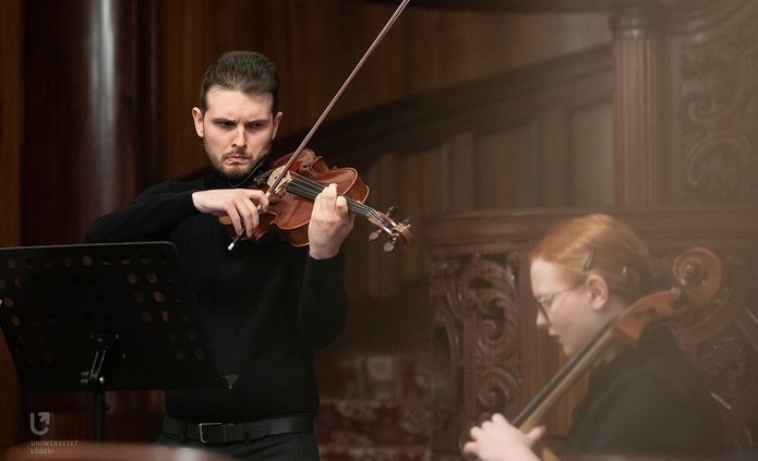 A violinist and a pianist during a concert