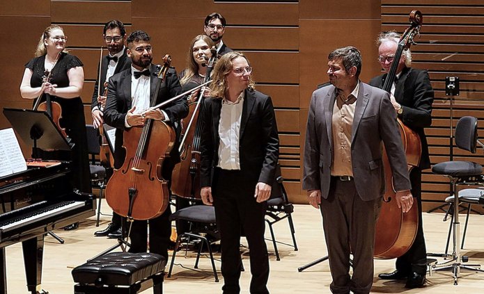 The piano duet in a concert hall